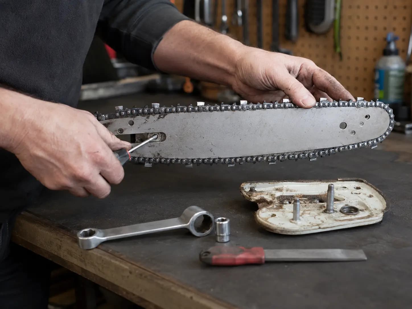 Chainsaw being inspected because its chain will not move